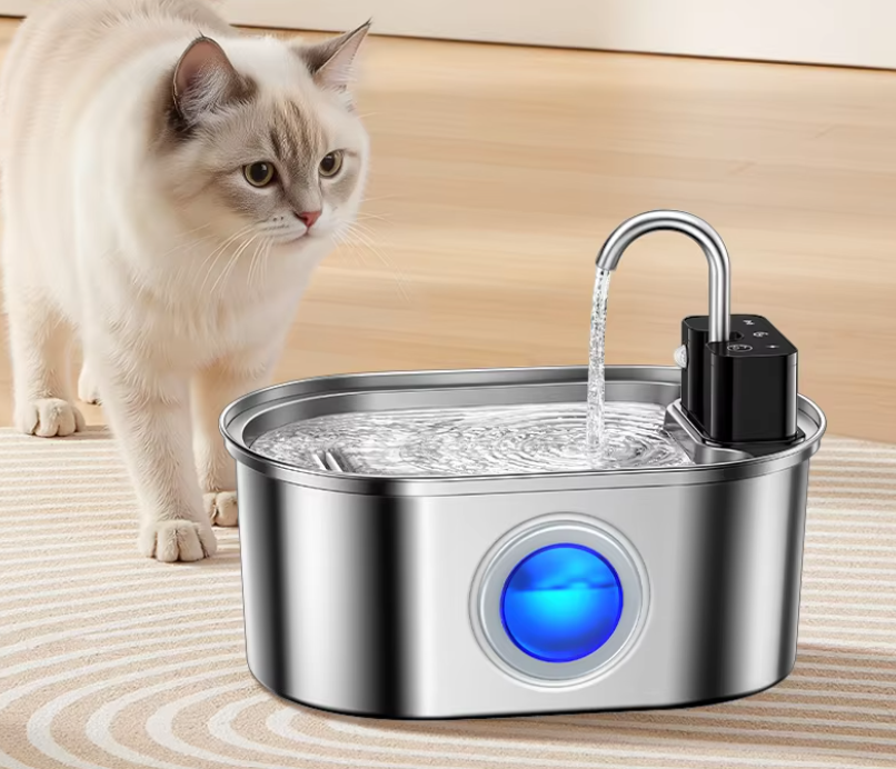 Cream-colored cat approaching the PurrFlow fountain to drink